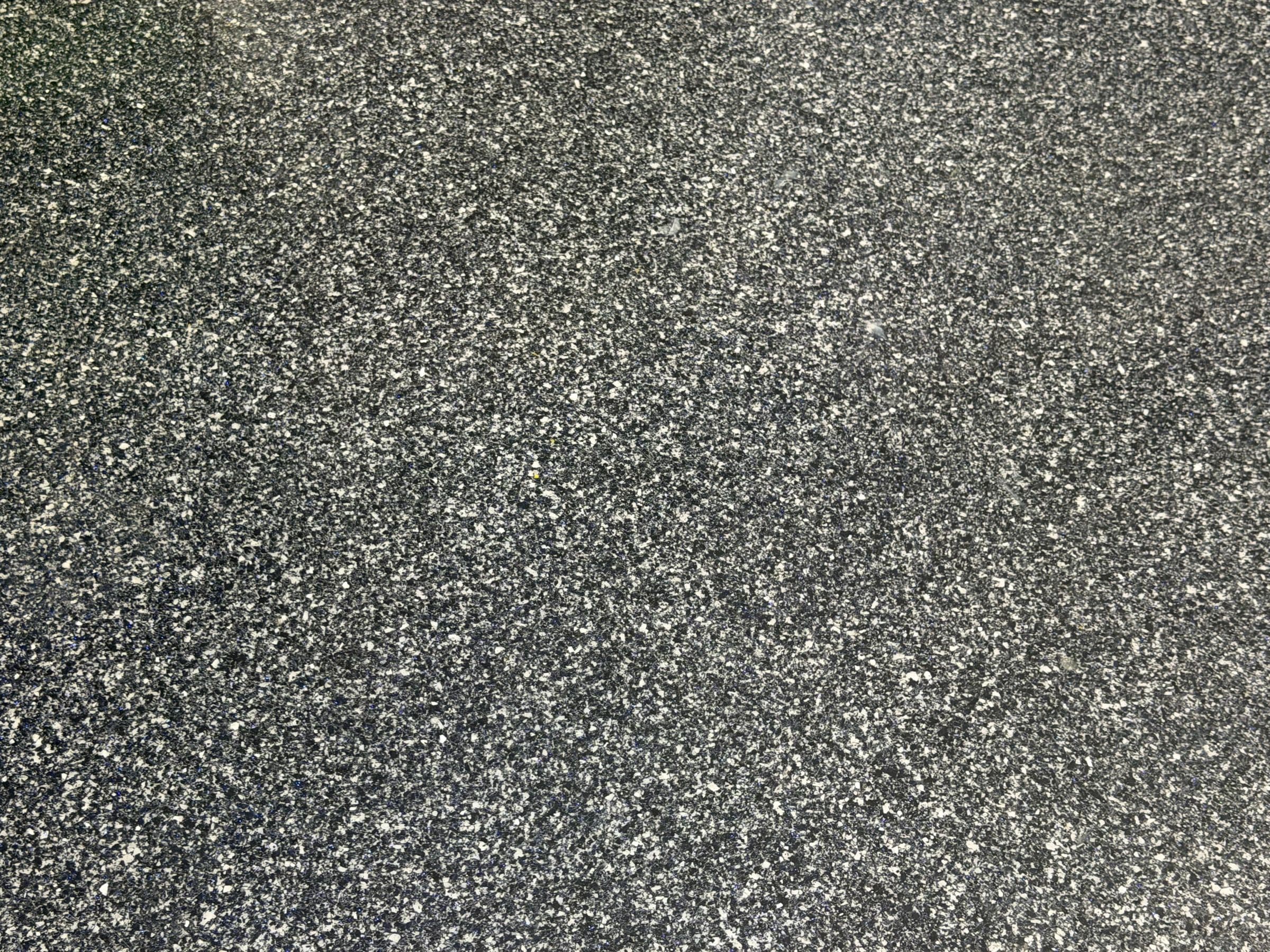 Charcoal flake floor coating close-up by Colin Coatings, Des Moines, Iowa