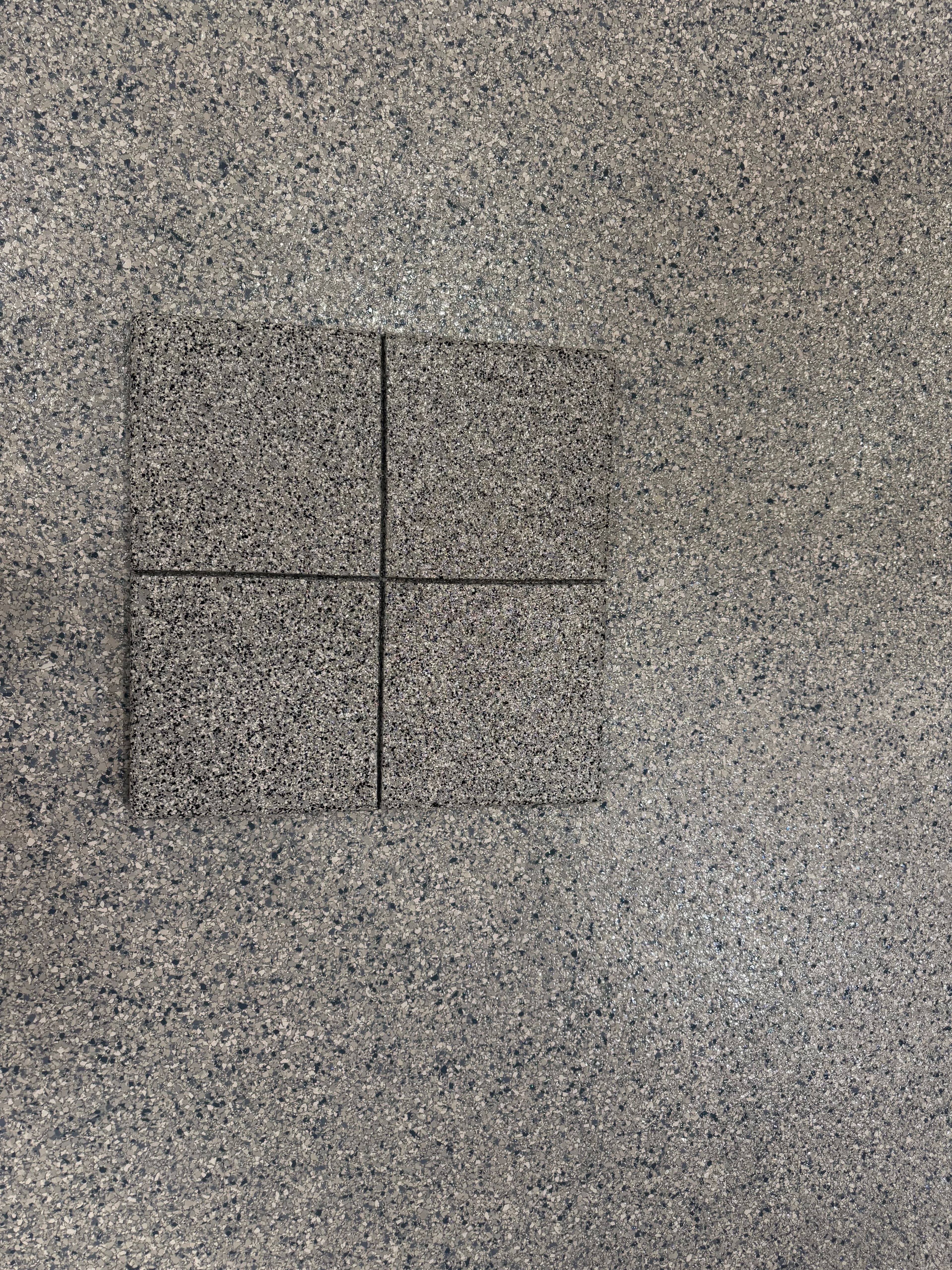 Full-broadcast flake floor coating close-up by Colin Coatings, serving Adel, Iowa