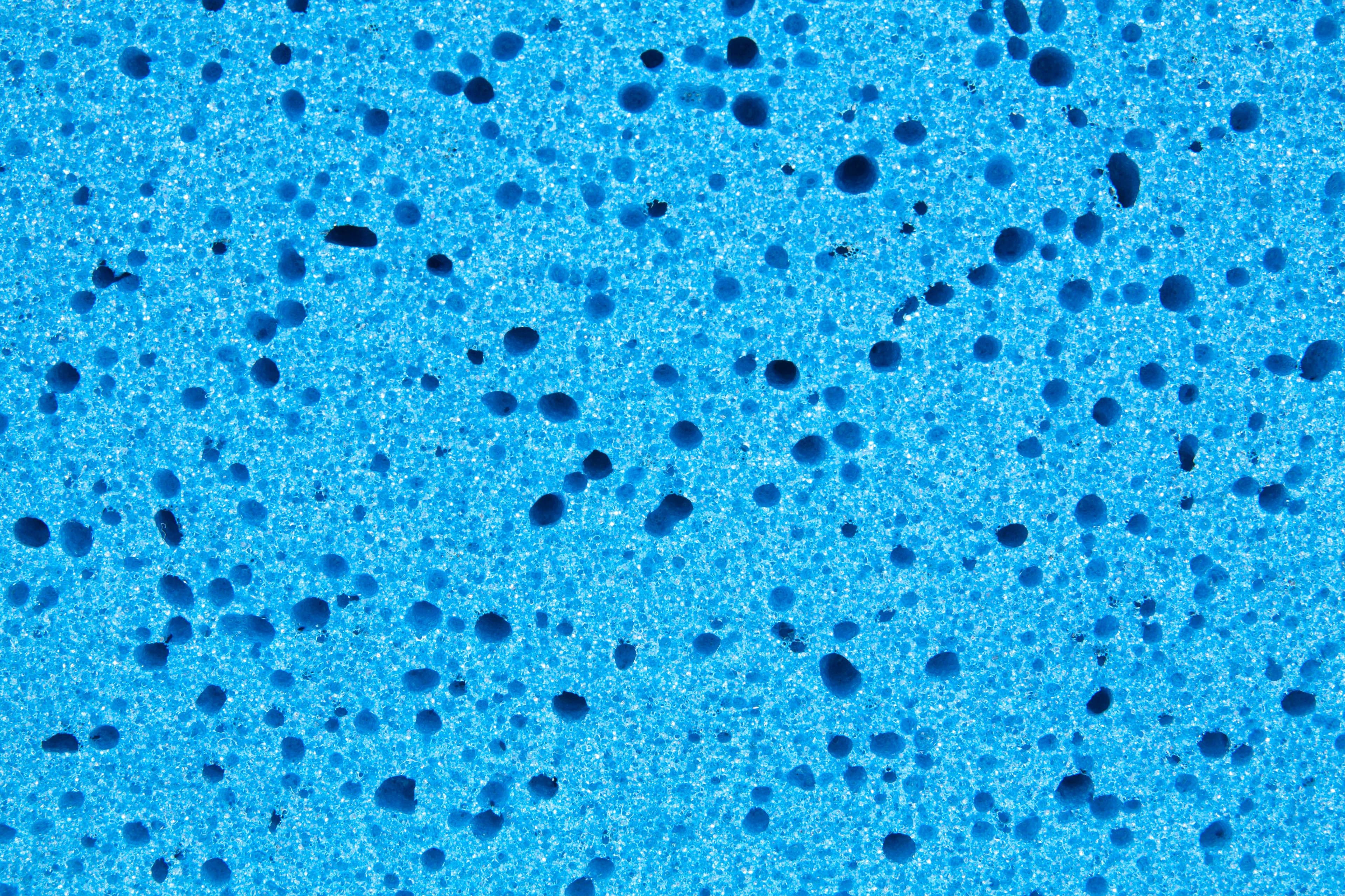 Blue flake floor coating close-up by Colin Coatings, serving Prairie City, Iowa